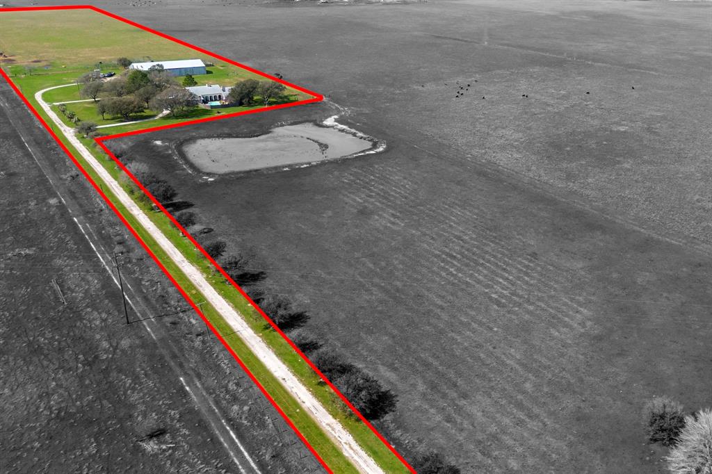 13 acres of cattle land right outside of Bay City just minutes from Matagorda Bay. This property has a 4750 square foot home, in ground pool and a barn that is over 7000 square feet! The ranch style home has 4 bedrooms, 3 full bathrooms and a spacious 1100 square foot, 3 car garage. The 2 living rooms and a game room with bar that opens up to the backyard and pool makes this an entertainers dream! Owner is open to selling the entire 62 acres. Get with the agent if interested. Call today for your private tour!