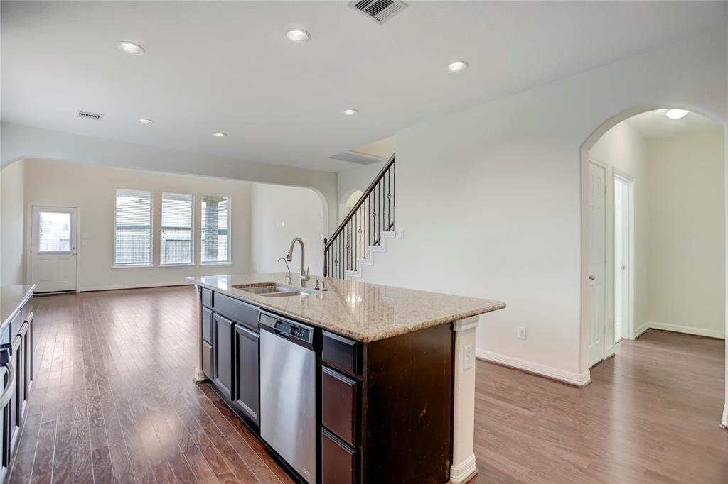 Look at those amazing dark cabinets and beautiful backsplash.