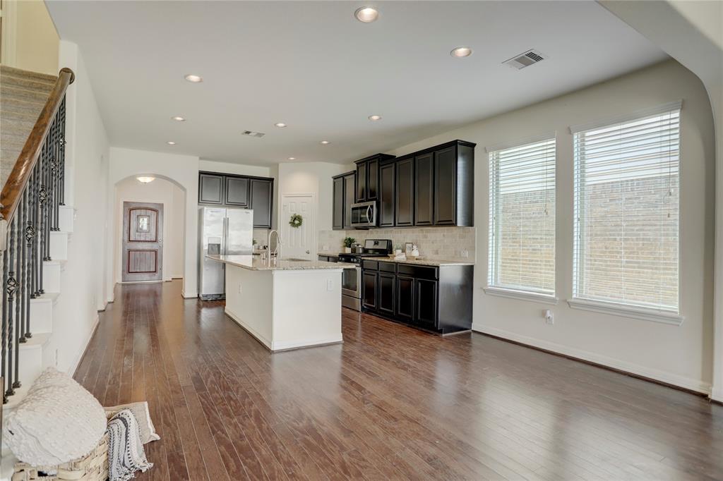 The kitchen and breakfast area leads right to your new living room!