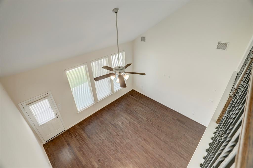 Great space for a game room with natural light coming from the windows.