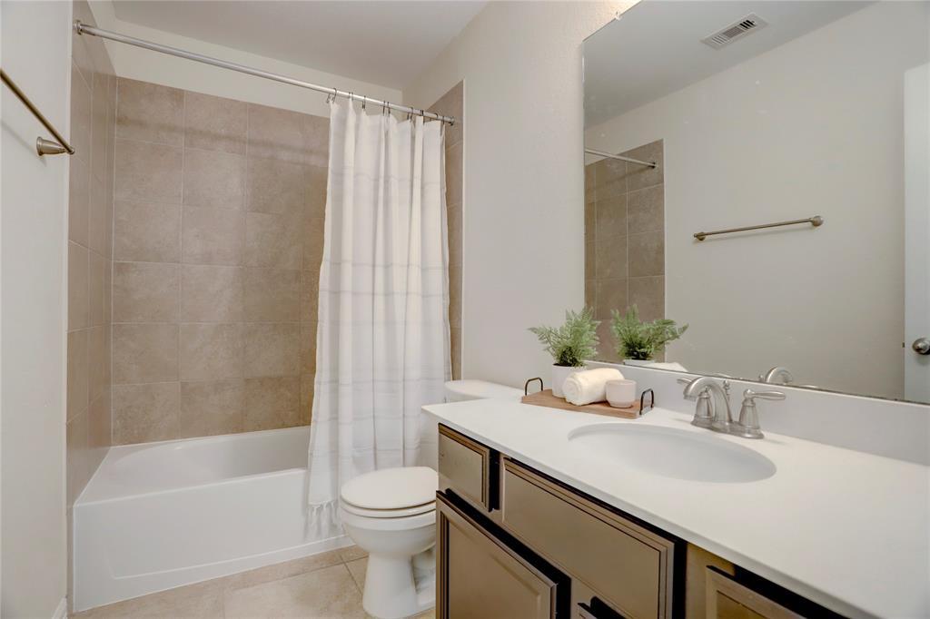 Washer and dryer area with great shelf space downstairs off the garage.