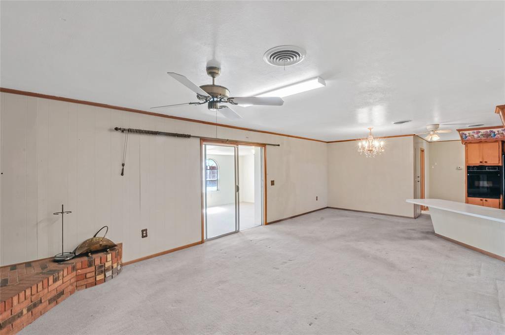 These sliding doors, off the den, open into the sunroom.