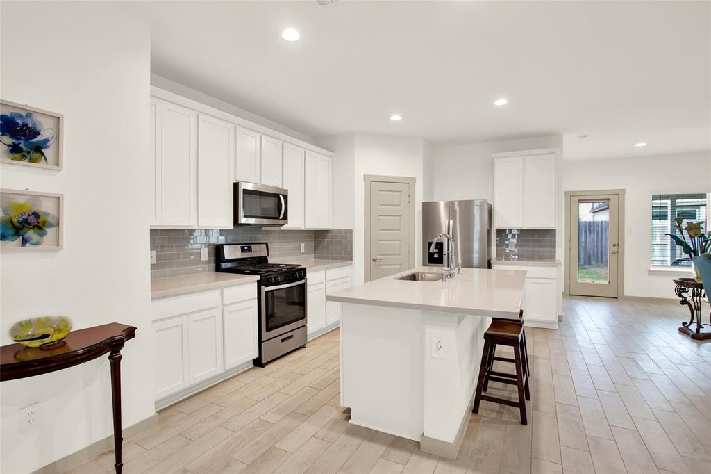 Gourmet Kitchen with gas cooking and stainless steel appliances that are included with sale.