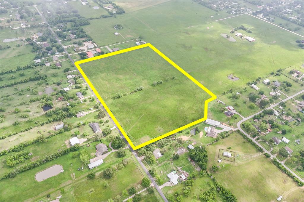 Transform this massive 26-acre lot in Santa Fe into something truly incredible. This sprawling, green lot is ready for you to build your dream home!  Situated off Hwy 6, commuters benefit from quick access to Galveston and other major business centers. Popular dining, shopping, and entertainment can be found minutes away at the La Marque Crossing Shopping Center, Tanger Outlets, and Mainland City Center. Nearby schools are a part of the Santa Fe ISD.