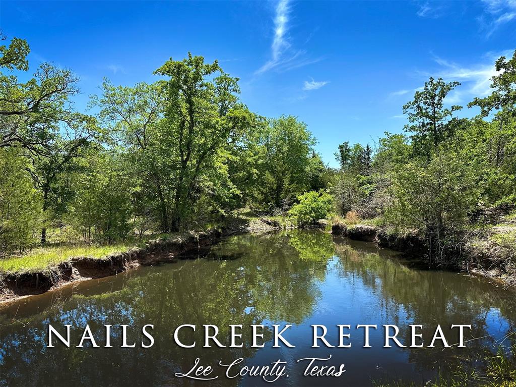 Ultimate private retreat featuring ±12 acres of rolling terrain and mature trees. Peaceful setting with abundant wildlife, two ponds and seasonal creek.  Conveniently located less than a mile to Nails Creek Park of Lake Somerville. Wonderful locations for building site with electric and community water available.  Situated just 25 minutes to Round Top, Brenham or Giddings and easy commute to Austin.  Open & wooded areas, shooting range in place, paved road frontage, unrestricted and no flood plain.  Ideal location for a weekend get-a-way or primary residence.  Additional acreage is available.