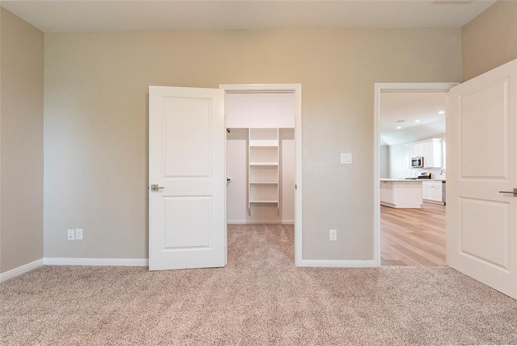 Primary bedroom looking out into family /kitchen