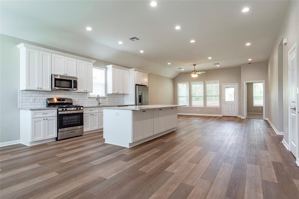 View of kitchen and living from front door