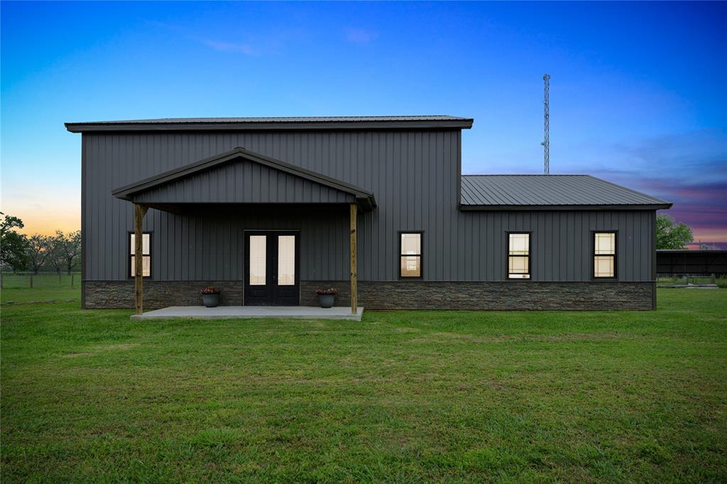 Welcome home to 5005 County Road 155 located in Wharton, TX and zoned to highly coveted BOLING ISD! If completed according to the plans, the finished home will feature 3 bedrooms, 3 full bathrooms, 1 half bathroom, 2nd floor loft and a 4 car attached garage all on 3.3 acres of super fertile Caney soil! The existing plans boast a spacious kitchen, open to the living room, featuring amble cabinets for storage, two windows overlooking the backyard, a 10 foot wide island with sink and lots of room for bar seating! You'll unwind after a long day in the primary suite.  The roomy primary ensuite bathroom will feature dual sinks, walk-in closet, walk-in shower with glass shower door and a window overlooking the backyard! Other features include Anderson windows, front and back covered patios, access from 2 public roads, pond, paneled wire perimeter and cross fencing, two gates and an RV hook-up! Low taxes & no HOA! Don't miss all this great property has to offer!  Schedule a tour today!