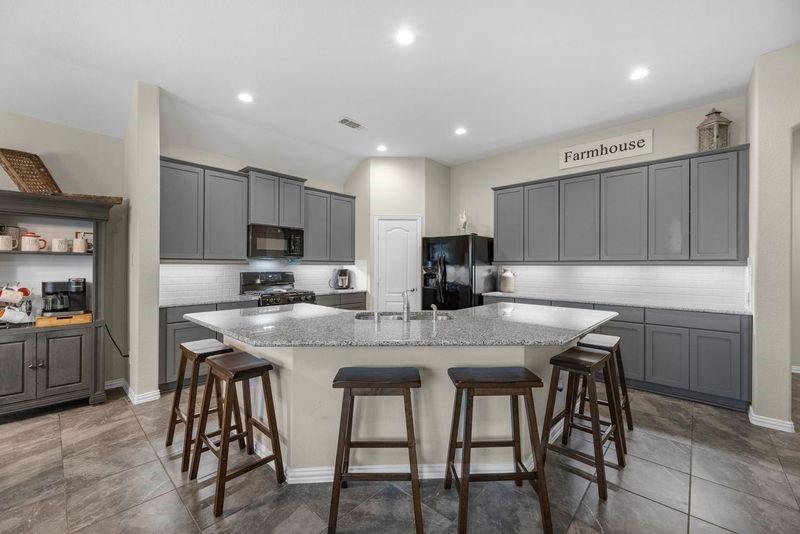 Undermount lighting, gas cooking, granite counters, walk-in pantry.  Refrigerator included!