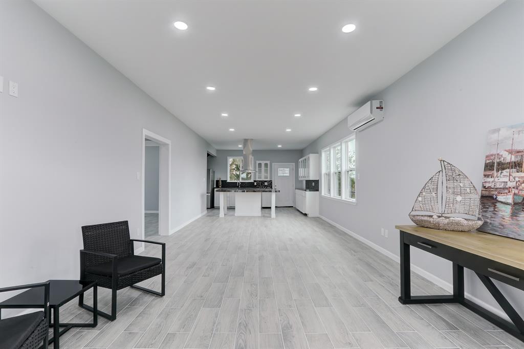 BEAUTIFUL OPEN DESIGN FROM THE DEN THROUGH THE DINING AND KITCHEN.