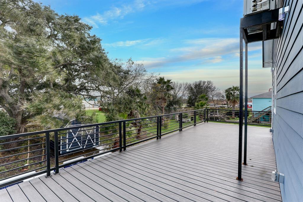 EXPANSIVE REAR BALCONY THAT OVERLOOKS THE POOL.