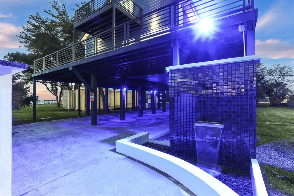 UPON ENTERING THE WALKTHROUGH GATE, YOU ARE GREETED BY A HAND-MADE TILED WATER WALL.