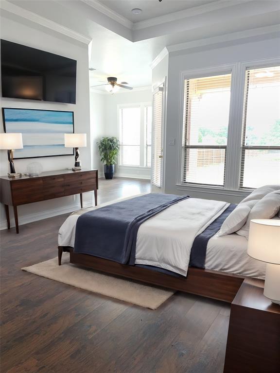 VIRTUAL STAGINGPrimary Bedroom with dark hardwood/wood-style floors, ceiling fan, and ornamental molding