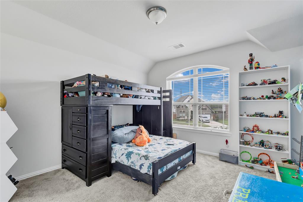 Spacious third bedroom upstairs with sloped ceilings