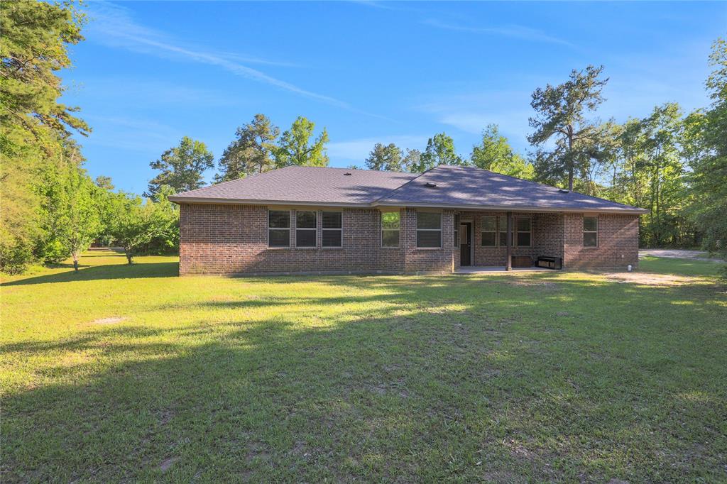 There is yard space around the back of the home along with a covered patio