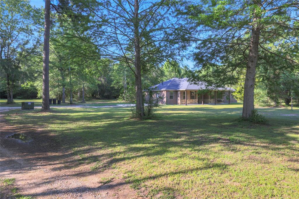 The area around the home site is partially cleared with the back of the property remaining wooded