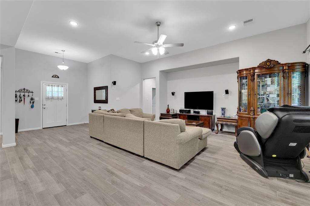 The living area has high ceilings and neutral colors throughout