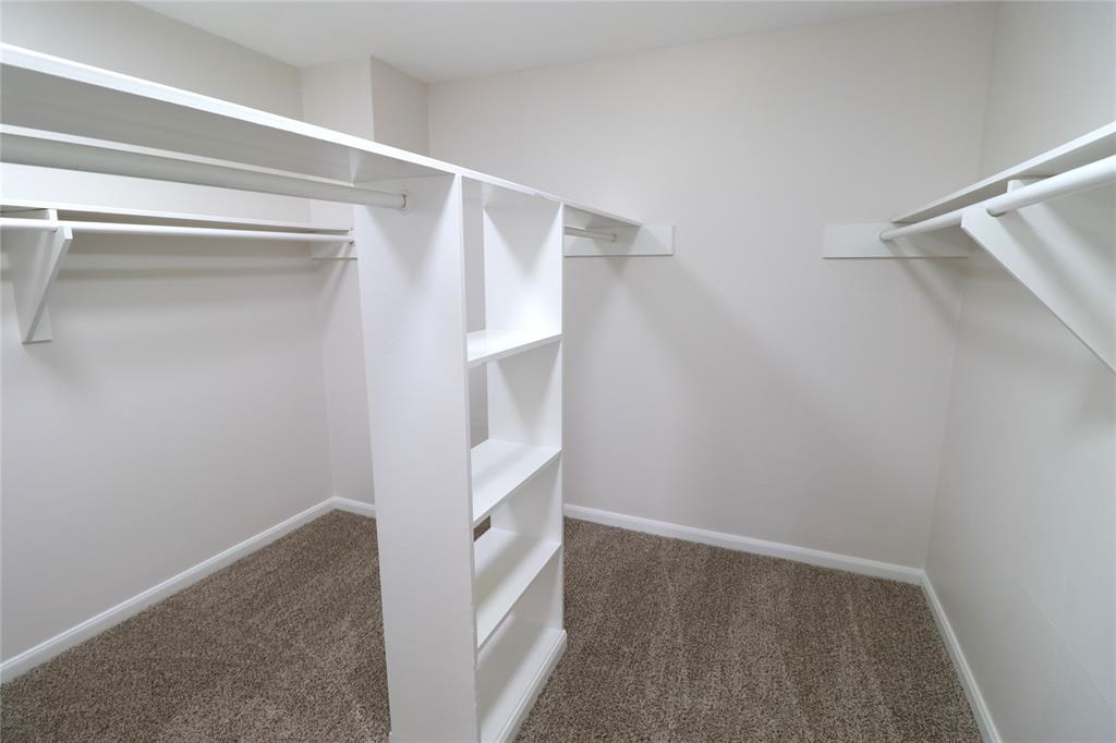 Walk-in primary closet.