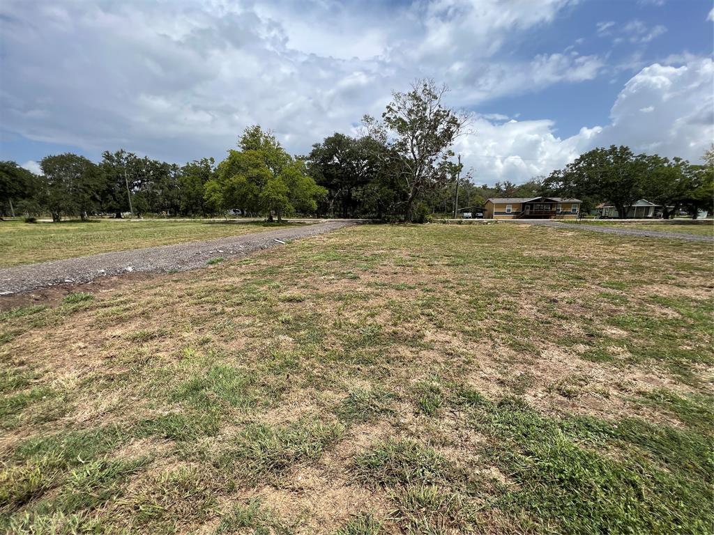 View towards CR 348 showing a driveway on each side of the property.