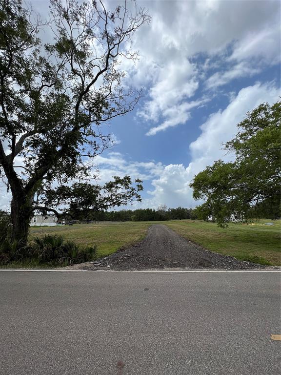 View from CR 348 of the long driveway that goes to the beginning of the back section.