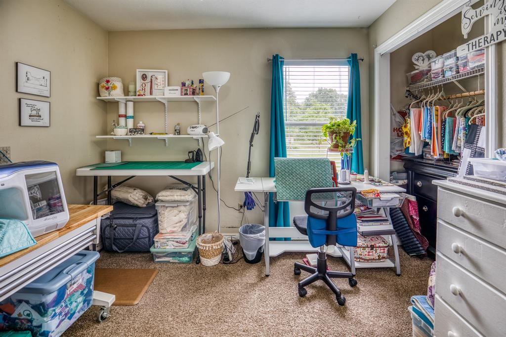 Larger secondary bedroom. Currently used as a sewing/craft room.