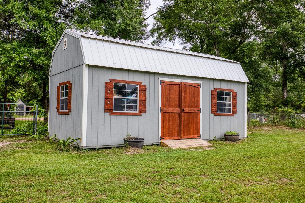 Recent improvement: 24\'x12\' barn/storage. Double doors on the front and a roll up door for easy access of yard equipment on the right side.