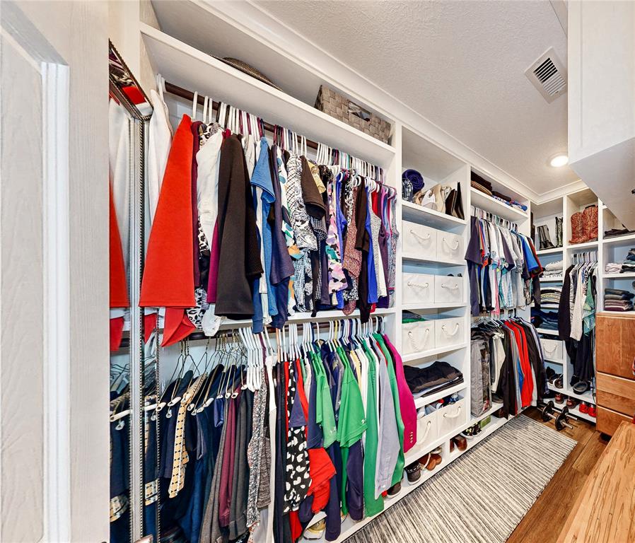 Nice oversized walk-in closet space in the Primary Bedroom. The owners had custom built-in\'s for optimal storage and organization.