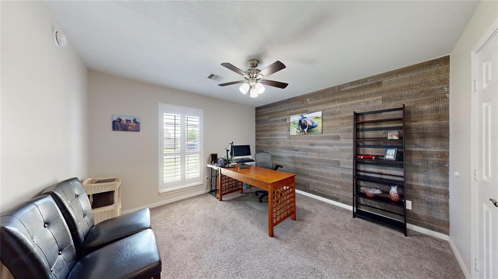 Secondary Bedroom. The second and third bedrooms are in the front of the home and share the 2nd full bath.