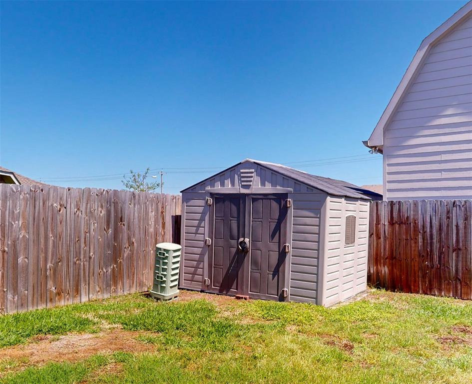 Storage shed in backyard stays! Extra storage so you can actually park in your garage.