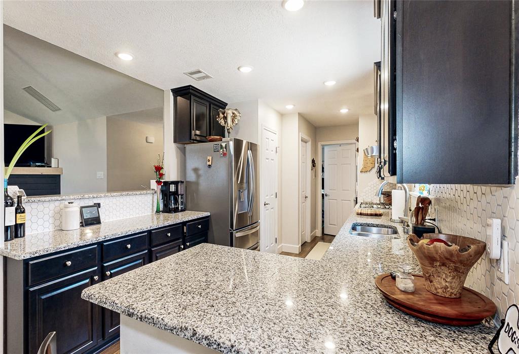 Stunning Kitchen opens into the Family room.