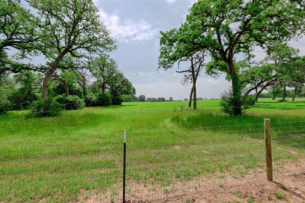 Beautiful, manicured setting on gently rolling hills with mature shade trees scattered thru out.  Improved pasture and hay production.  AG EXEMPTION in place. Ideal setting for custom home and barn in this peaceful area.  Electricity on the tract.  Public water available, located across the street on Farm to Market road.  Take in the view of the scattered trees including majestic live oaks and other native Texas trees.  Pastures are ready for the animals.  Property is currently used as a horse ranch, so all fencing is set up for horses.  Bring the animals, the dream floorplan and the rocking chair to start enjoying Texas sunsets among the tranquility of the country.  This 14.5 acre tract is out of the historic Dogwood Gulch Ranch. Own a piece of Texas History today.  Aggie Expressway (249) and Highway 105 W, located to the south of the subject property.   Got to come see this one.