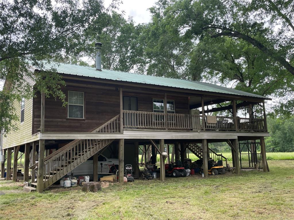 Hunters Paradise in Leon County! This unique property has some of everything and is located in the Trinity River bottom. The elevated home is ideal for entertaining, relaxing and watching the wildlife with plenty of deer and hogs.
You can hunt off of the 22'x40' covered deck. All accessible by two stairways. This is in a flood plane and the back part of the property is usually wet...(ideal for hogs). This is occupied full time by the owners, but would make a perfect weekend retreat. The property is fenced if you decide to run cattle or other livestock.
