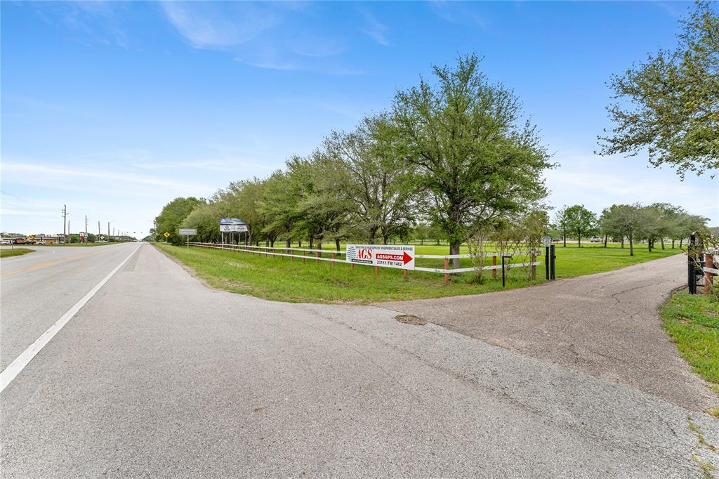 The property for sale is on the right side of this photo and this is the view looking east on FM 1462 toward 288.