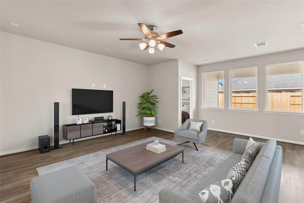 Your family room has ample space to entertain family and friends. This space features beautiful floors, fresh paint, ceiling fan with lighting, and high ceilings.