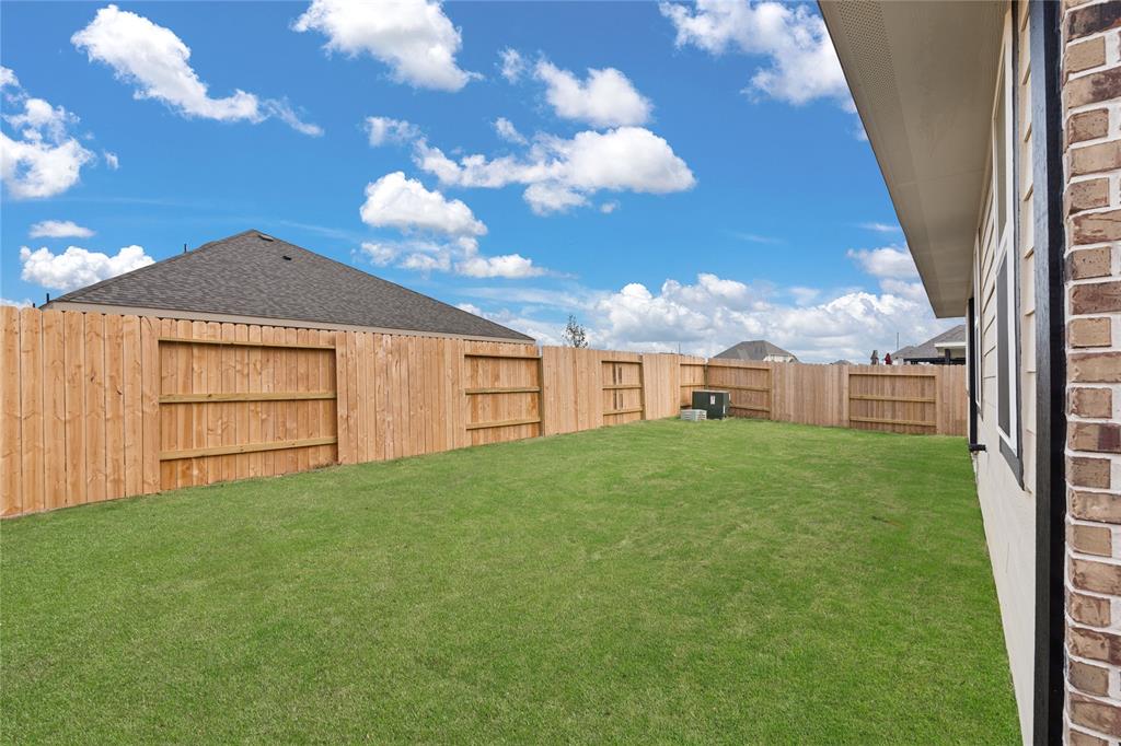 This backyard is perfect for family gatherings, social events, or simply unwinding in the fresh air.