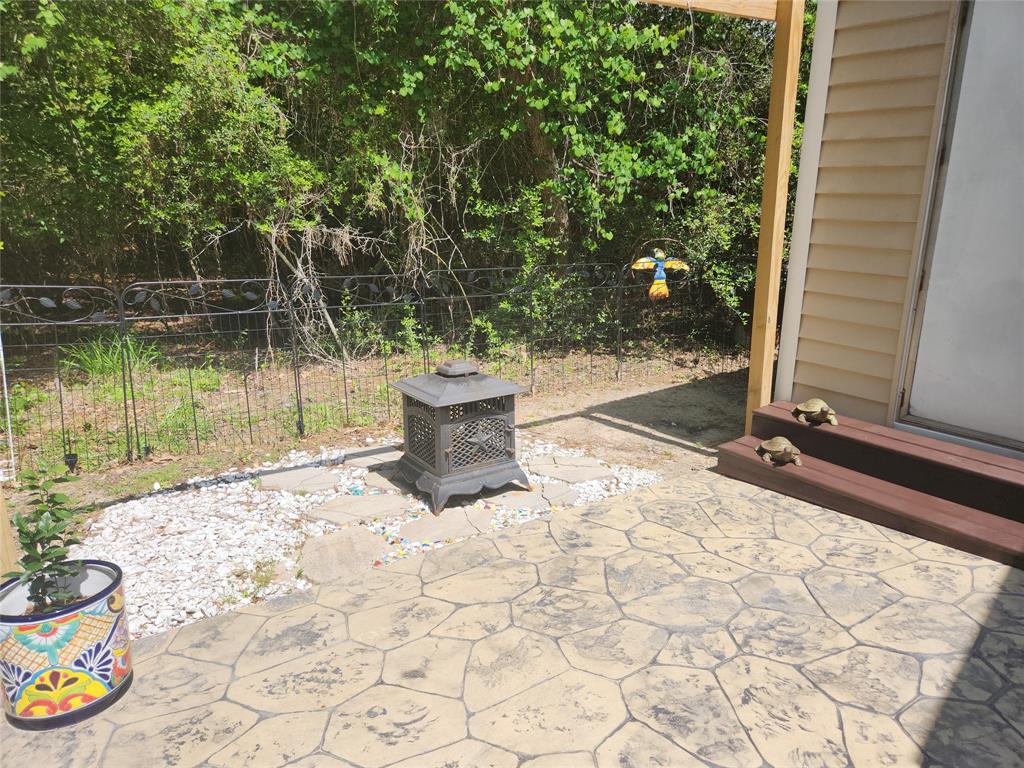 Stamped concrete patio in back to add your own fire ring or BBQ  pit