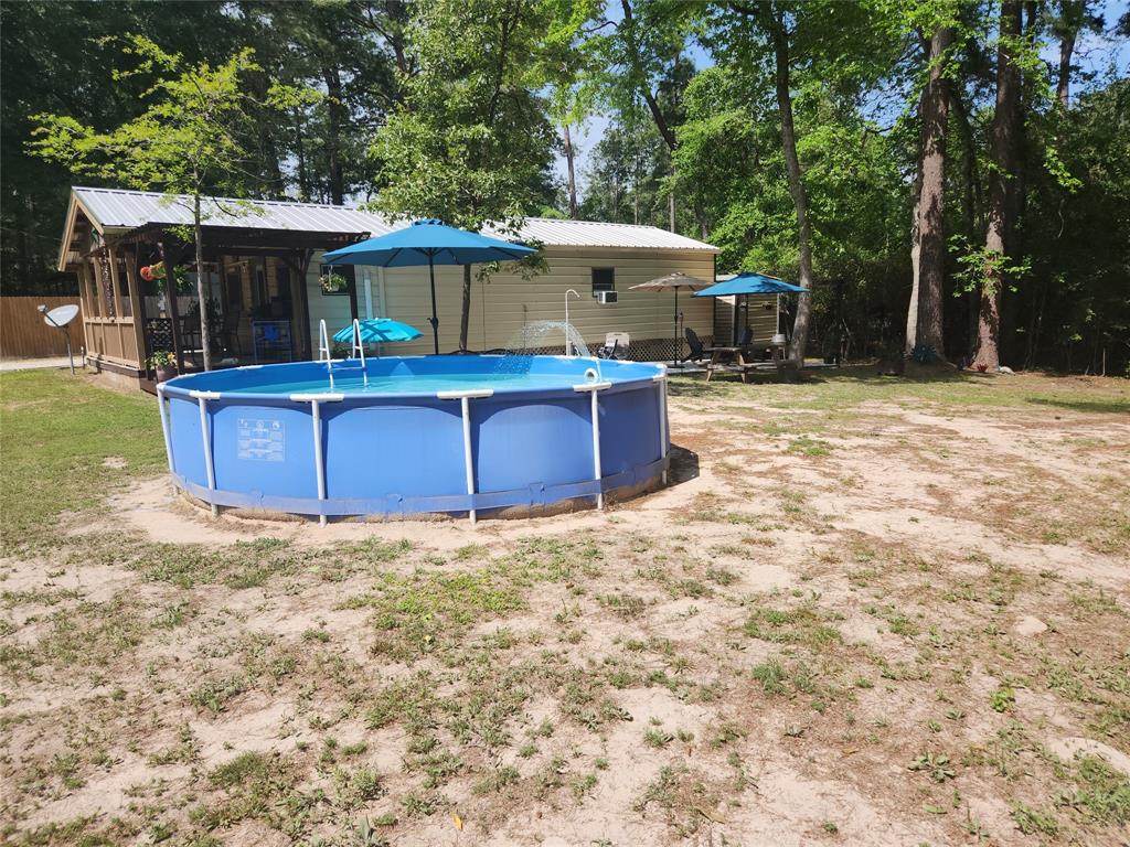 Pool has a water spraying feature for additional cooling in this relaxing area!