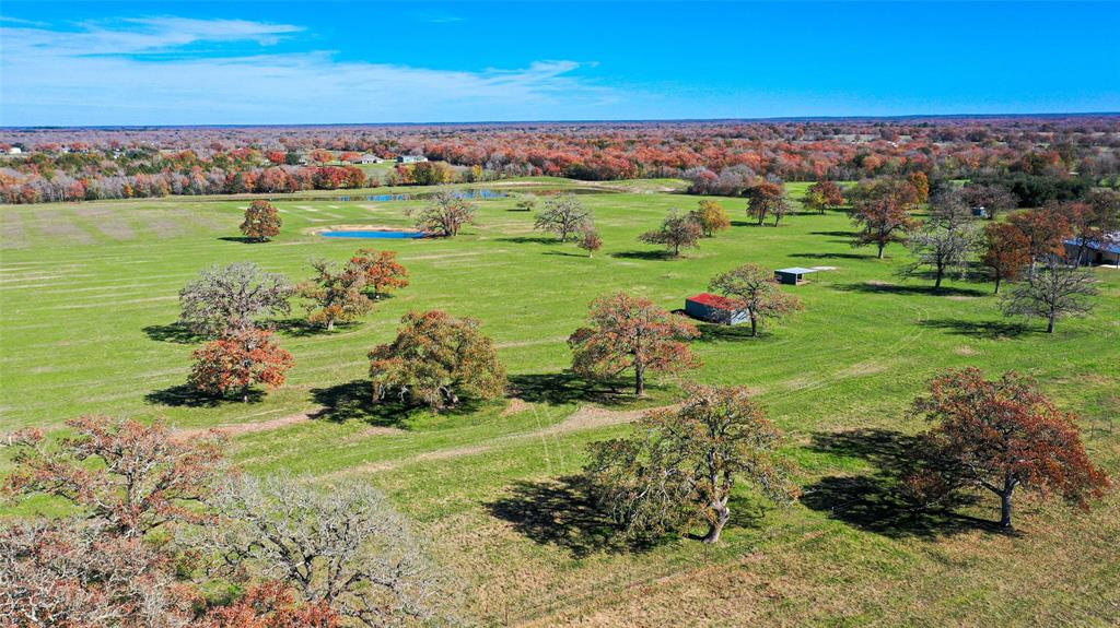 Location! Location! Location! Rare opportunity to own 24+/- unrestricted acres within 5 minutes of College Station and all the amenities it has to offer. With a park like setting the mostly open property features improved grasses mature hardwood trees and a stocked pond.  The property also boasts 570’+/- of paved frontage on Dyess Road plus access to Wickson Creek's water line making this property a candidate for a potential development or just a great investment to hold. If your looking for a weekend retreat or spot close to Aggieland to build your dream home, this property fits that ticket too!!  Additional Acreage Available.