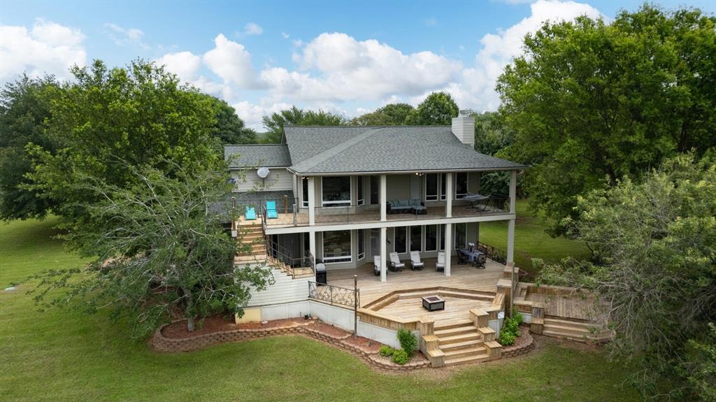 Back of home with balconies overlooking Lake Limestone