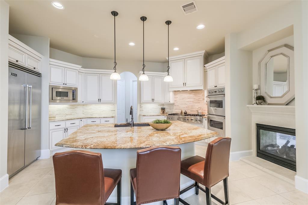 Nestled within the confines of a gated community, this exquisite 4-bedroom, 4-full/2-half bath residence sits on a corner lot, exuding elegance & charm. Meticulously maintained, the home boasts a plethora of amenities, including a spacious game room, private study & media room. The 1st level welcomes you w/ a chef's dream kitchen, complete w/ granite countertops and top-of-the-line Viking appliances, seamlessly flowing into a cozy family room adorned w/ gleaming wood floors. 3 generously sized bedrooms, each accompanied by its own en-suite bath, while the 3rd level hosts the 4th bedroom along w/ the game & media rooms. Outdoor living featuring a covered patio graced with a two-sided fireplace, a luxurious hot tub & the added comfort of 2 ceiling fans. Further enhancing the allure of this home are its amenities, including a wet bar, a wine room & 2 tucked away hidden rooms. Other home features include: Double pane windows, zoned to SBISD, breakfast bar, 3 fireplaces & so much more!