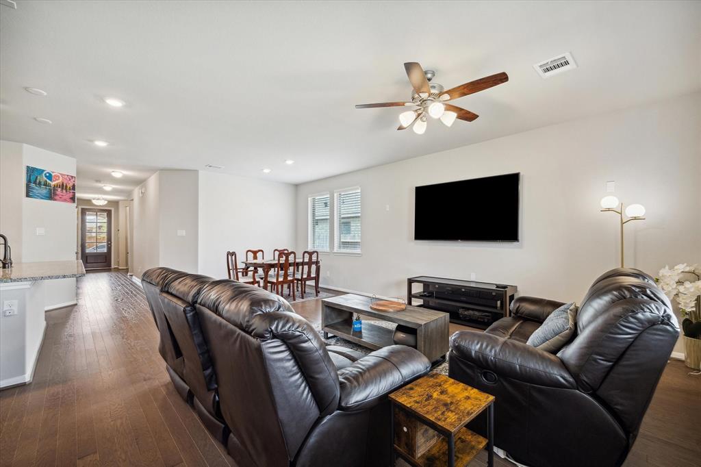 WOODEN FLOORS THROUGHOUT THE LIVING, DINING, AND KITCHEN AREAS.  THE LIVING ROOM IS WIRED FOR SURROUND SOUND.