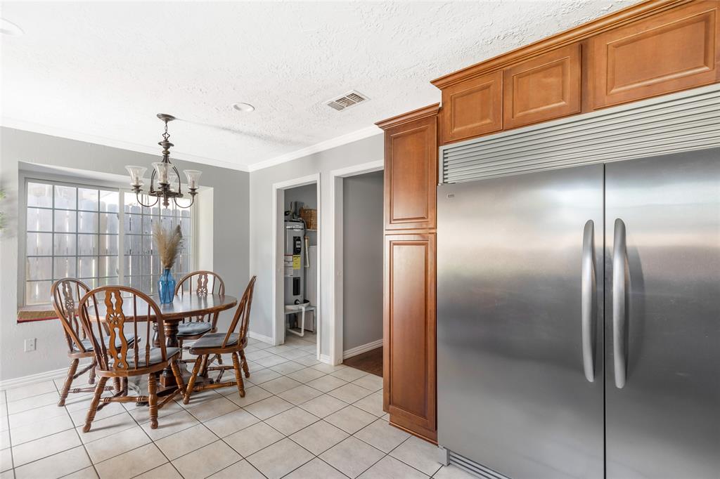 Kitchen with double-wide refrigerator and breakfast nook