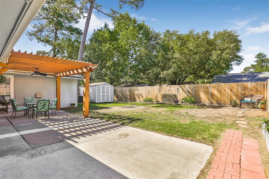 Back yard with storage shed, patio, and pergola