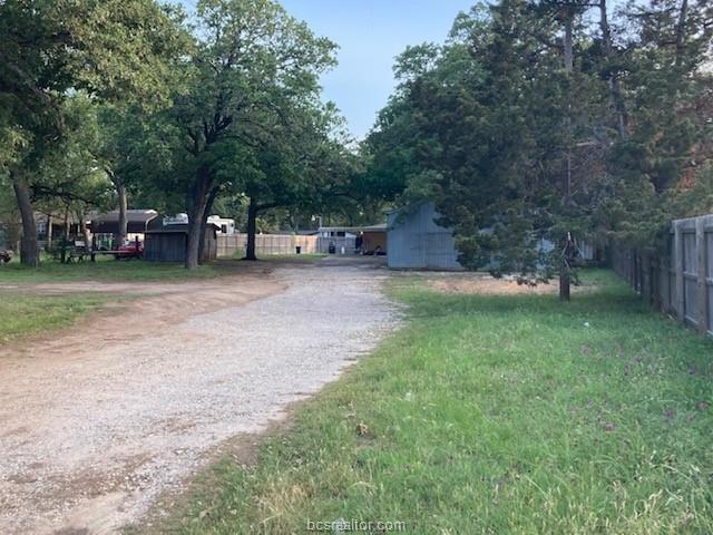 Lots of opportunity with this 1/2 Acre lot with nice trees! Build your dream home here and have plenty of room for outdoor living and a big workshop for home hobbies, projects and storage! Convenient location near schools and shopping. Just a short drive to entertainment and restaurants in beautiful Downtown Bryan! Or....hit the Freeway for quick access to College Station and TAMU! Call Cathy at 281-513-1763 for more information and to schedule a showing!