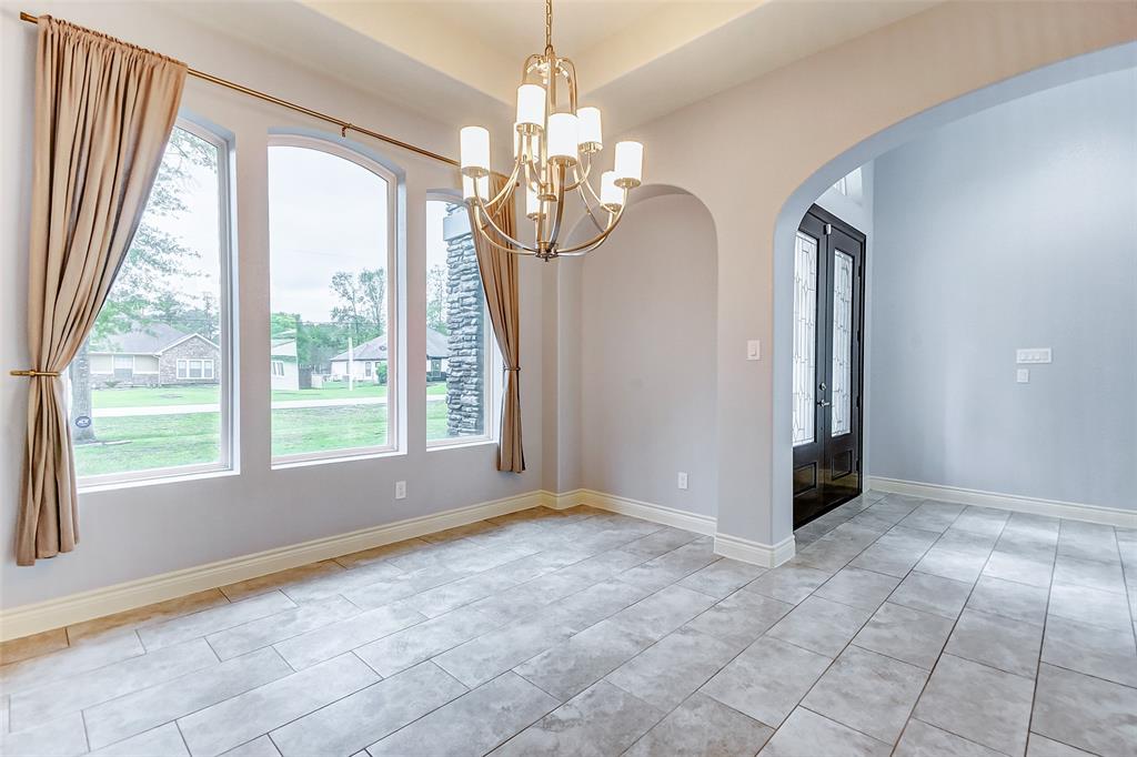 Formal dining room with windows facing the front yard