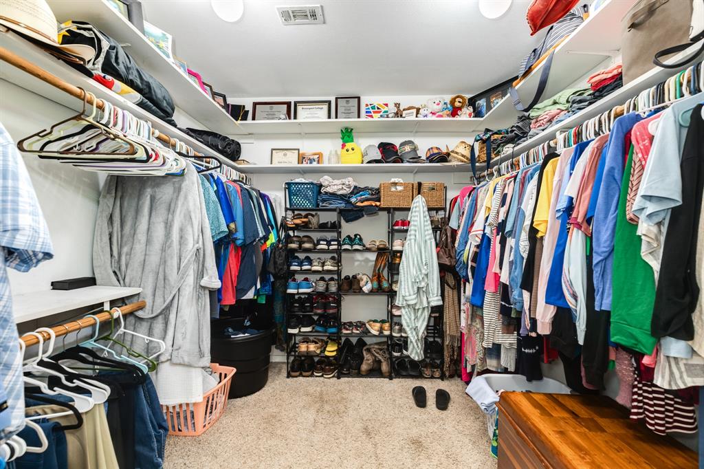 Primary bedroom walk-in closet