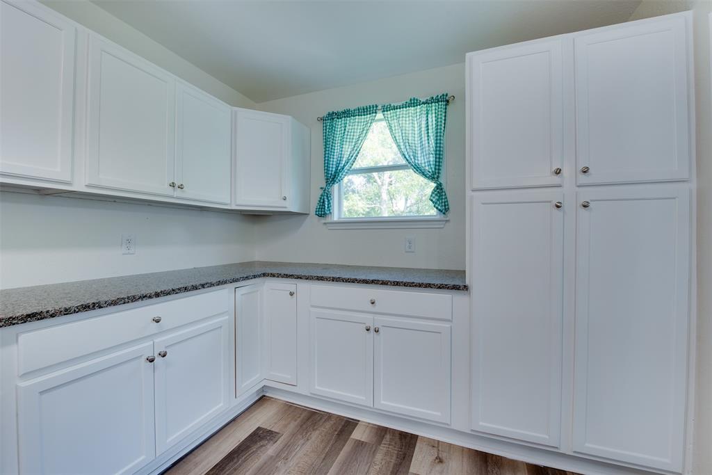 Abundant counter space and a walk-in pantry provide storage galore in the kitchen. (Some virtual staging may be present)