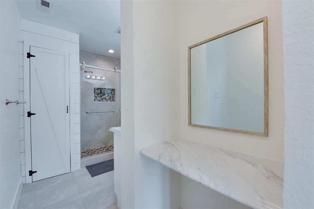 Primp in the vanity area situated perfectly between the master bedroom and bath. (Some virtual staging may be present)