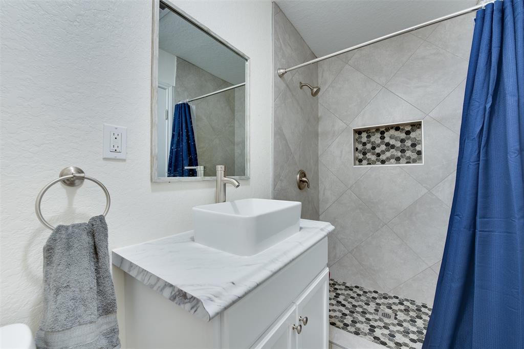 Freshen up in the hall bath\'s inviting stand-up shower. (Some virtual staging may be present)