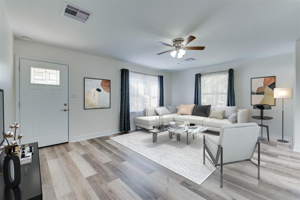 Bathed in natural light, the living room offers a relaxing respite after a long day. (Some virtual staging may be present)